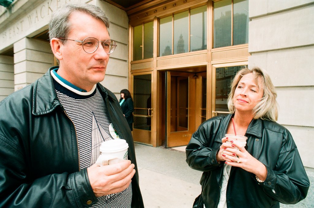 Coffee drinkers talk outside of Starbucks - Chicago Sun-Times