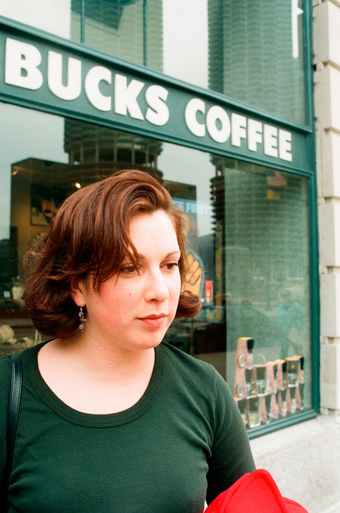 Coffee drinkers talk outside of Starbucks - Chicago Sun-Times
