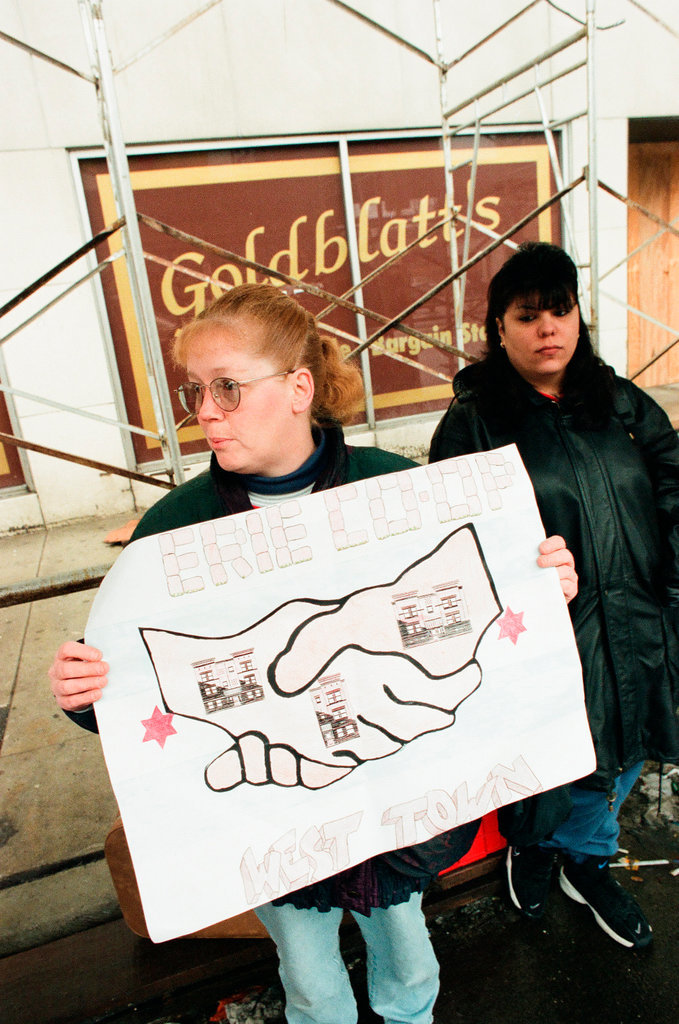 Demonstrators standing outside of Goldblatt's building - Chicago Sun-Times