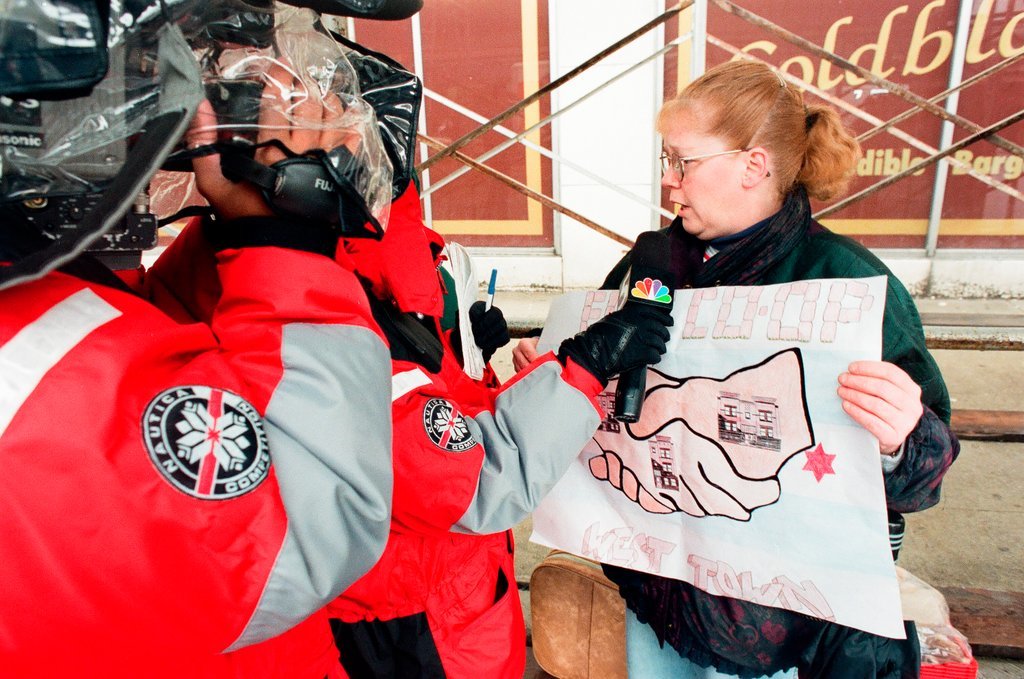 Demonstrators standing outside of Goldblatt's building - Chicago Sun-Times