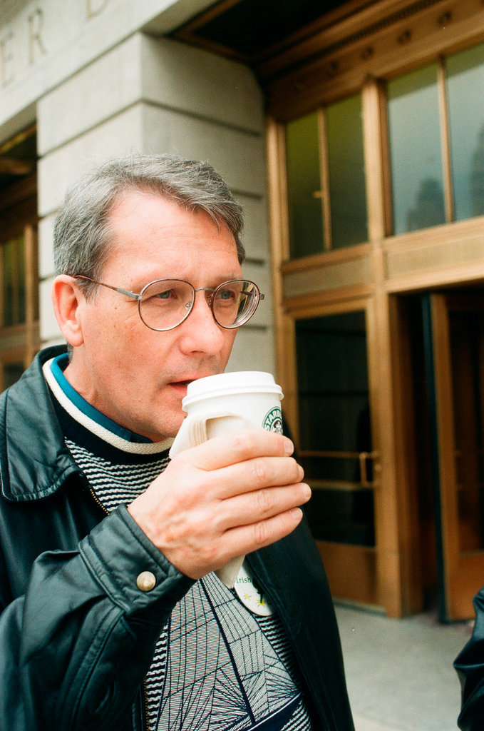 Coffee drinkers talk outside of Starbucks - Chicago Sun-Times
