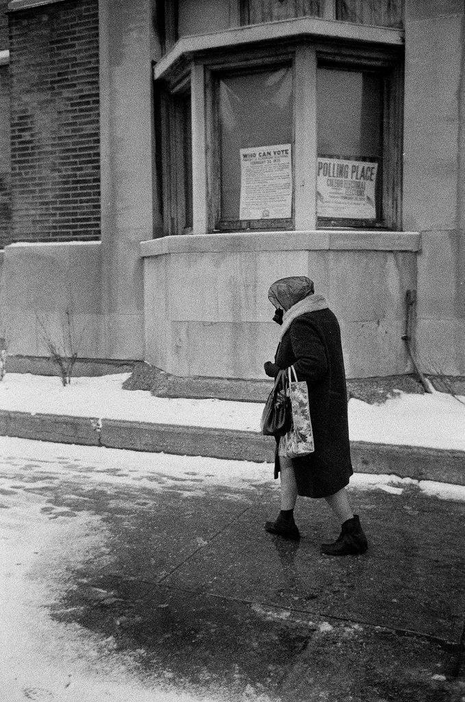 Women walking past a polling place - Chicago Sun-Times
