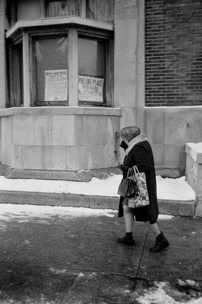 Women walking past a polling place - Chicago Sun-Times