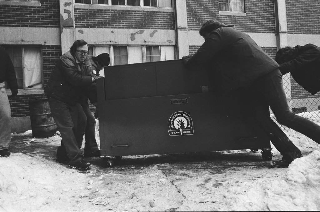 Voting machine being unloaded from a truck - Chicago Sun-Times