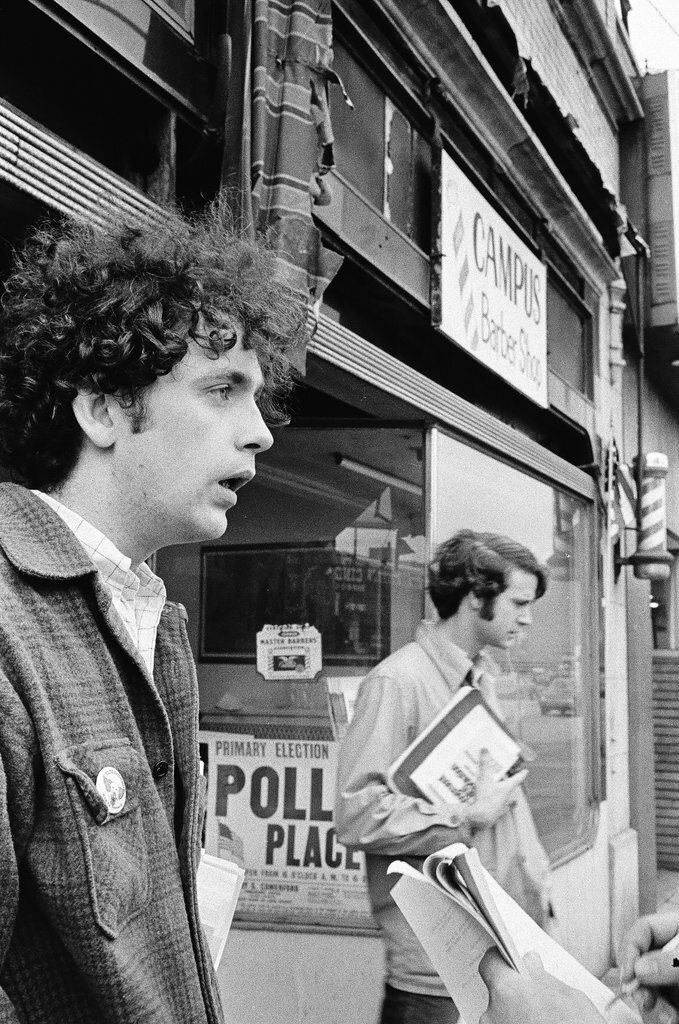 Young people speaking outside a polling place on Sheridan - Chicago Sun-Times