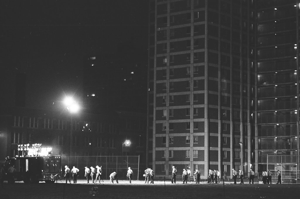 Group of police officers moving through Cabrini Green housing project - Chicago Sun-Times