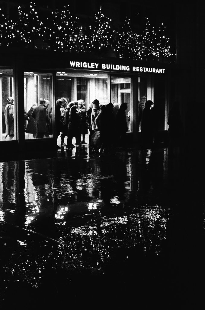 People waiting for the bus in rain - Chicago Sun-Times