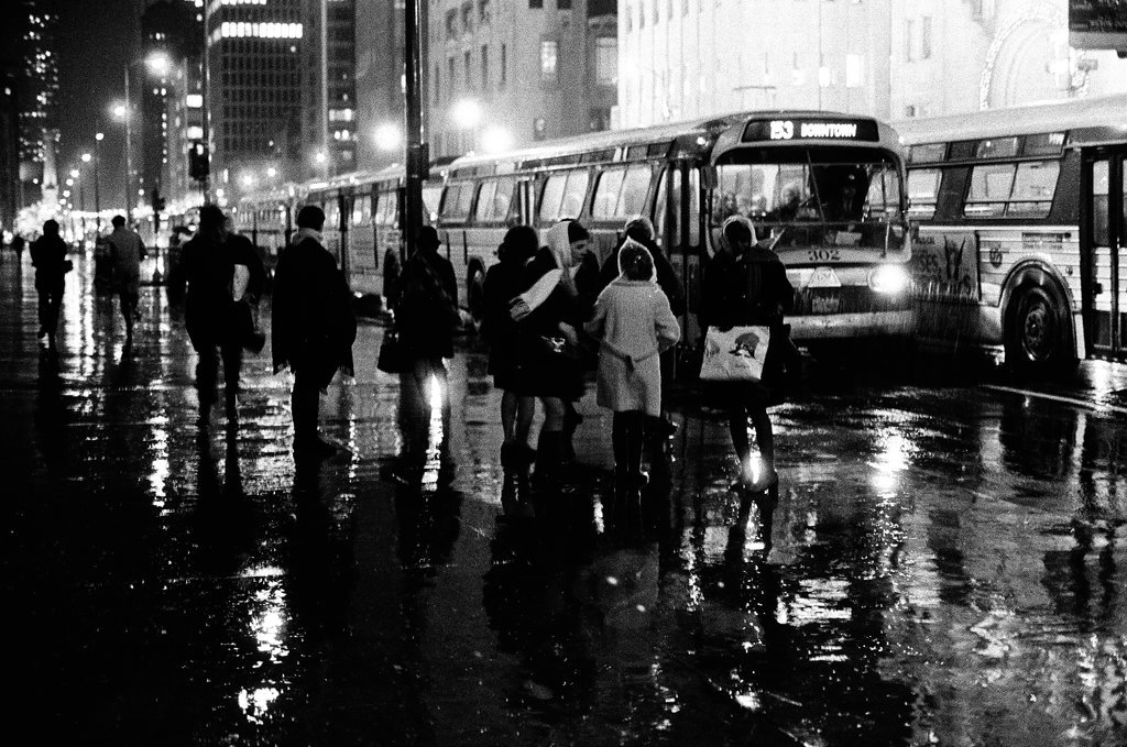 People waiting for the bus in rain - Chicago Sun-Times