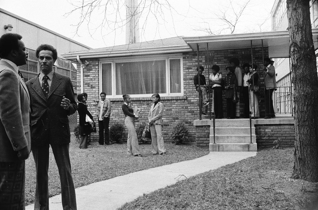 Principal and students standing outside of Dunbar High School - Chicago Sun-Times