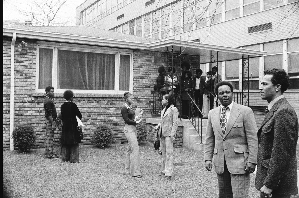 Principal and students standing outside of Dunbar High School - Chicago Sun-Times