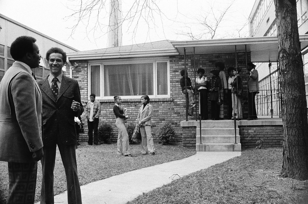 Principal and students standing outside of Dunbar High School - Chicago Sun-Times