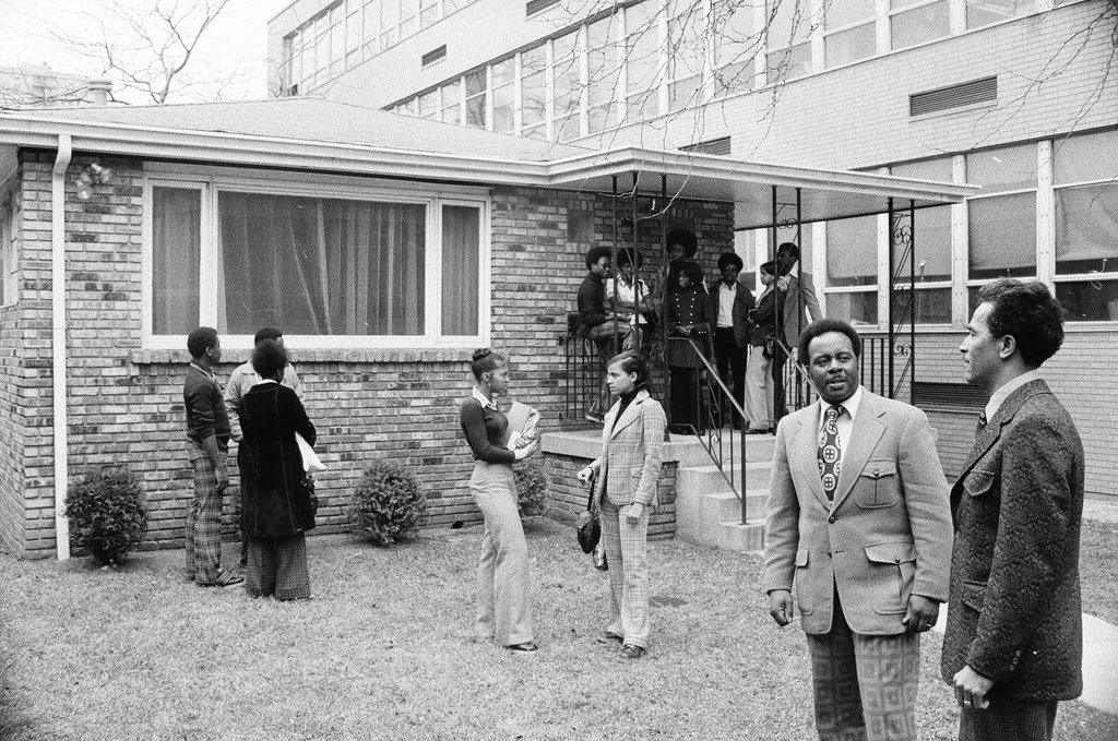 Principal and students standing outside of Dunbar High School - Chicago Sun-Times