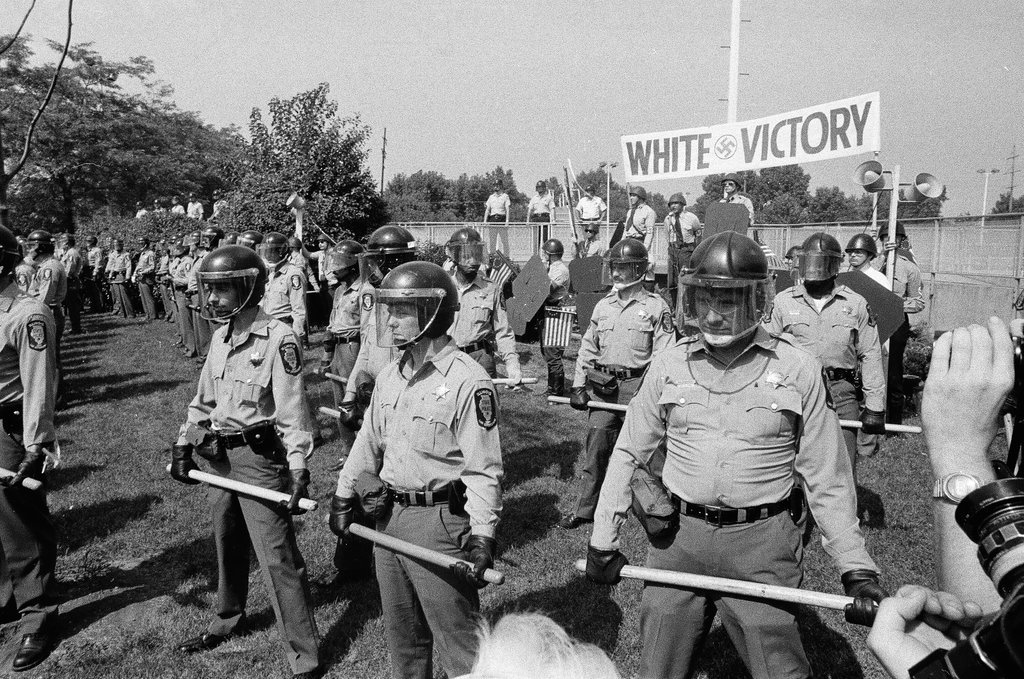 American Nazi Party members protected by line of policemen during rally - Chicago Sun-Times