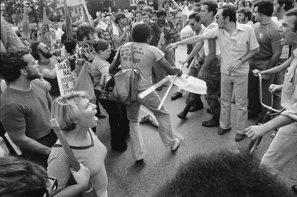American Nazi Party members protected by line of policemen during rally - Chicago Sun-Times