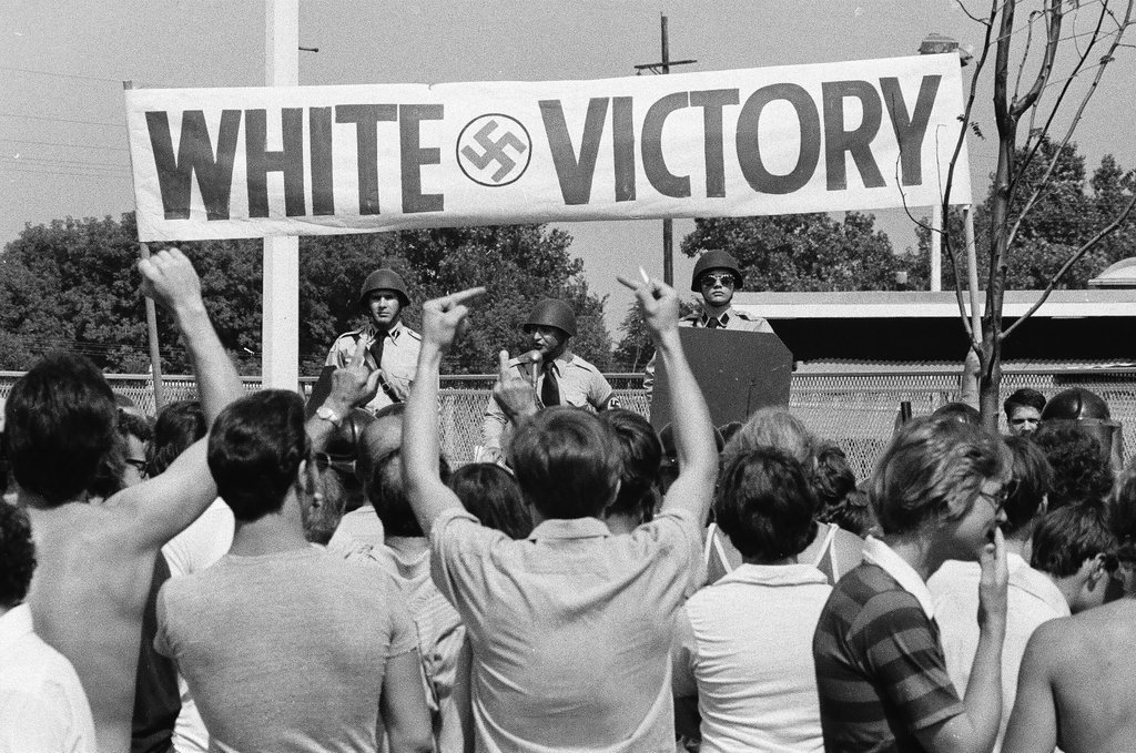 American Nazi Party members protected by line of policemen during rally - Chicago Sun-Times