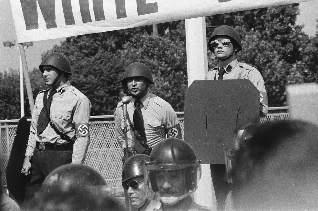 American Nazi Party members protected by line of policemen during rally - Chicago Sun-Times