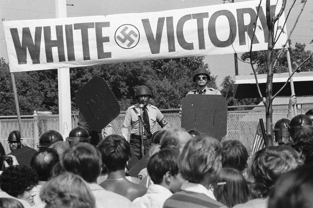 American Nazi Party members protected by line of policemen during rally - Chicago Sun-Times