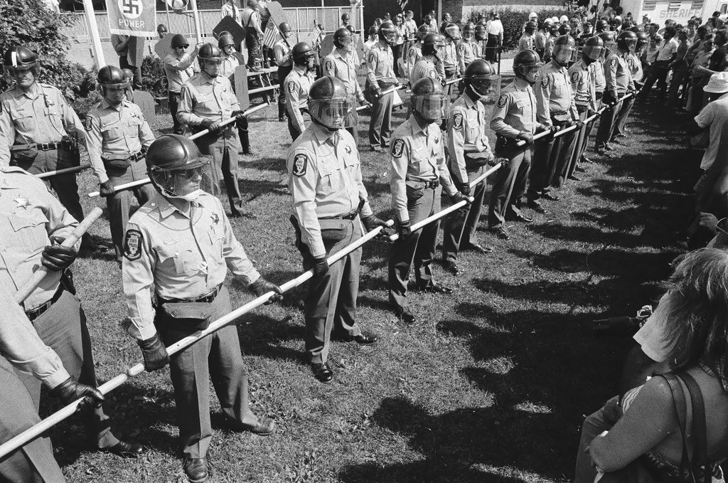 American Nazi Party members protected by line of policemen during rally - Chicago Sun-Times