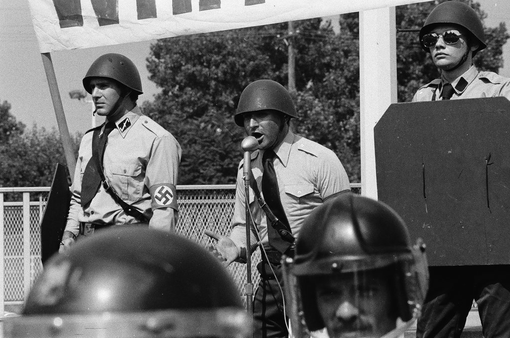 American Nazi Party members protected by line of policemen during rally - Chicago Sun-Times