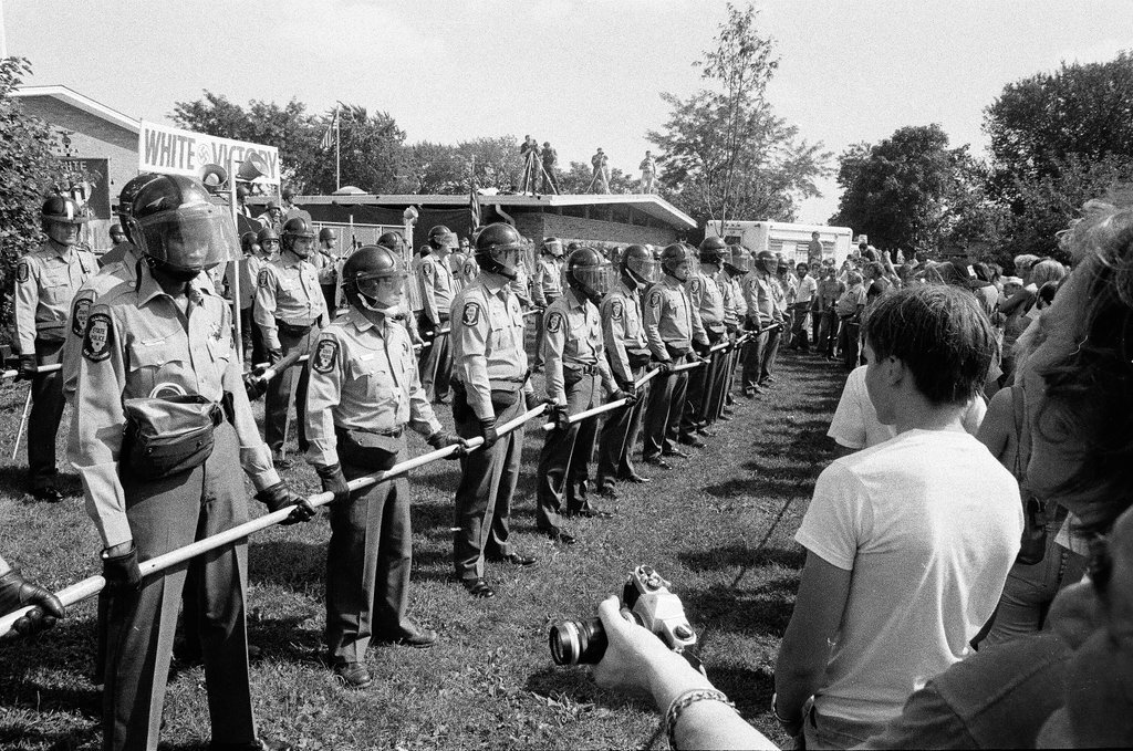 American Nazi Party members protected by line of policemen during rally - Chicago Sun-Times