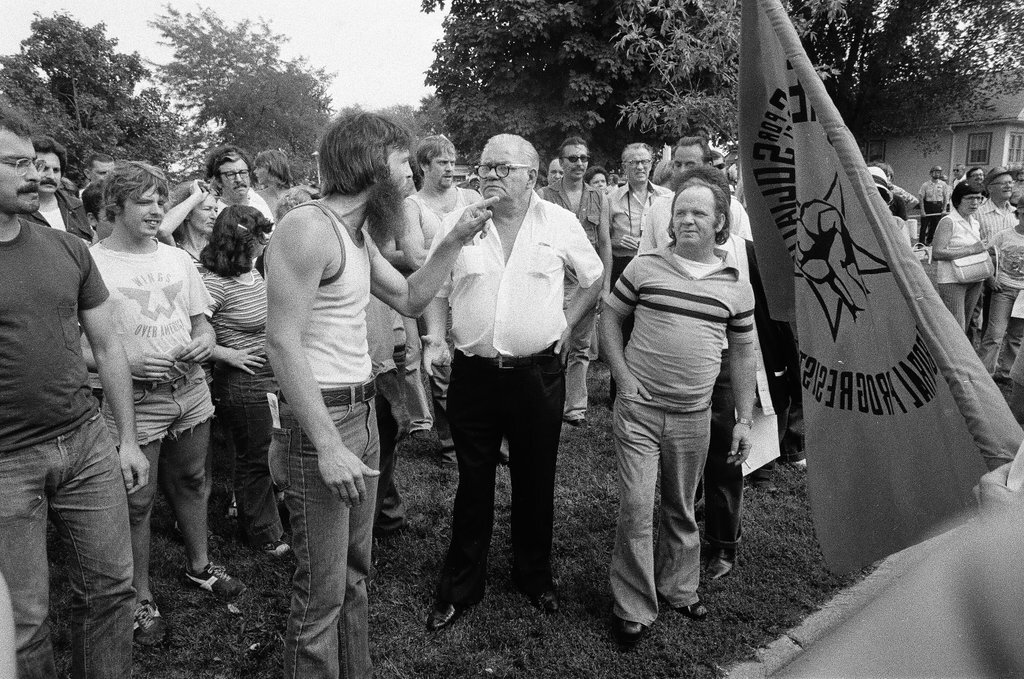 American Nazi Party members protected by line of policemen during rally - Chicago Sun-Times