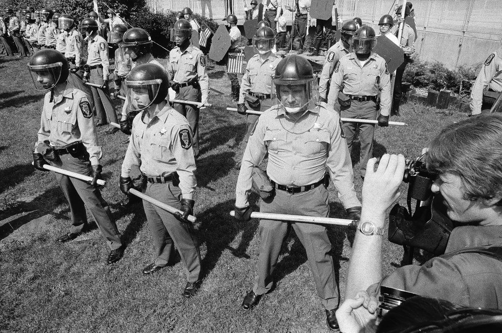 American Nazi Party members protected by line of policemen during rally - Chicago Sun-Times