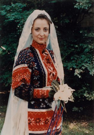 Jane Sara Cooperman wearing Ukrainian wedding gown. - Unknown