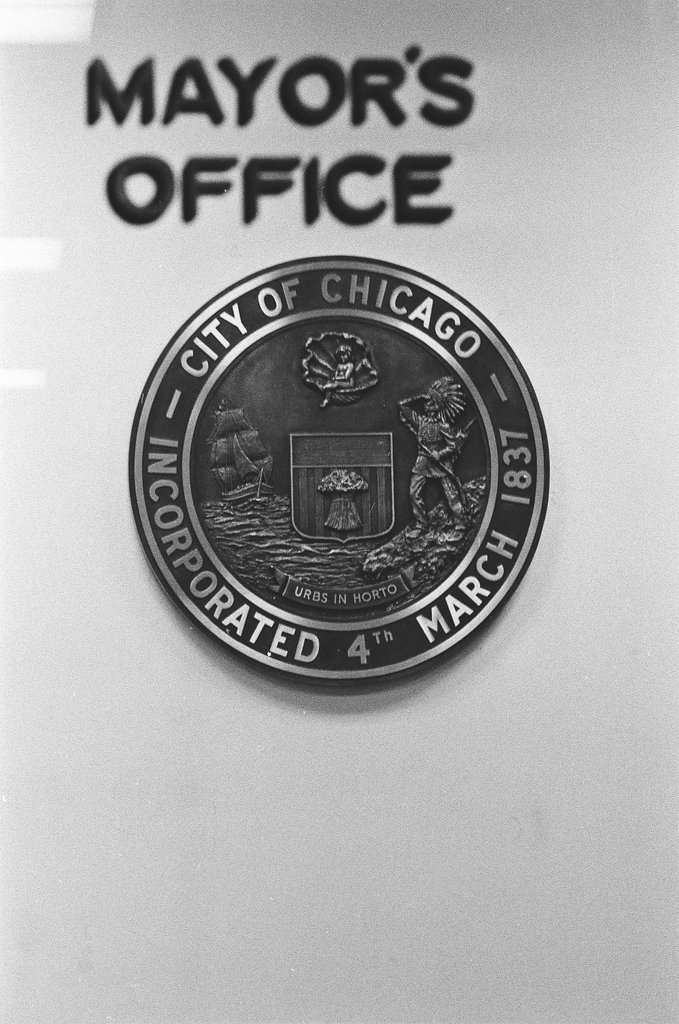 Workmen hang city seal in Mayor's Office - Chicago Sun-Times