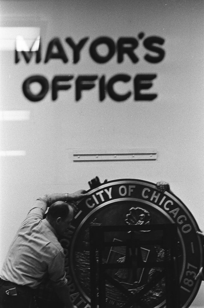 Workmen hang city seal in Mayor's Office - Chicago Sun-Times