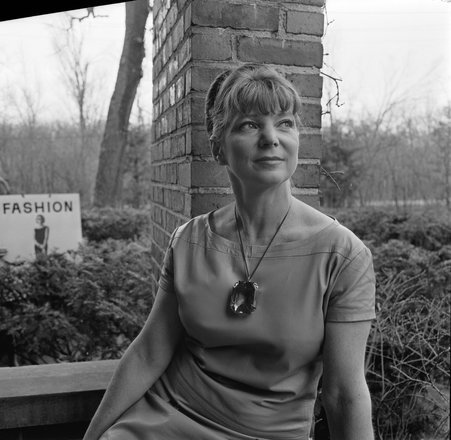 Mrs. Albert Newman at the Art Institute May Festival with Fashion sign behind - Klotz for Chicago Daily News, Inc.
