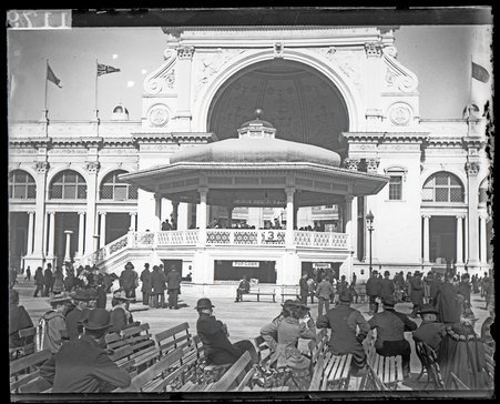 Bandstand outside the Electricity Building with visitors on benches in foreground, World's Columbian Exposition - Unknown
