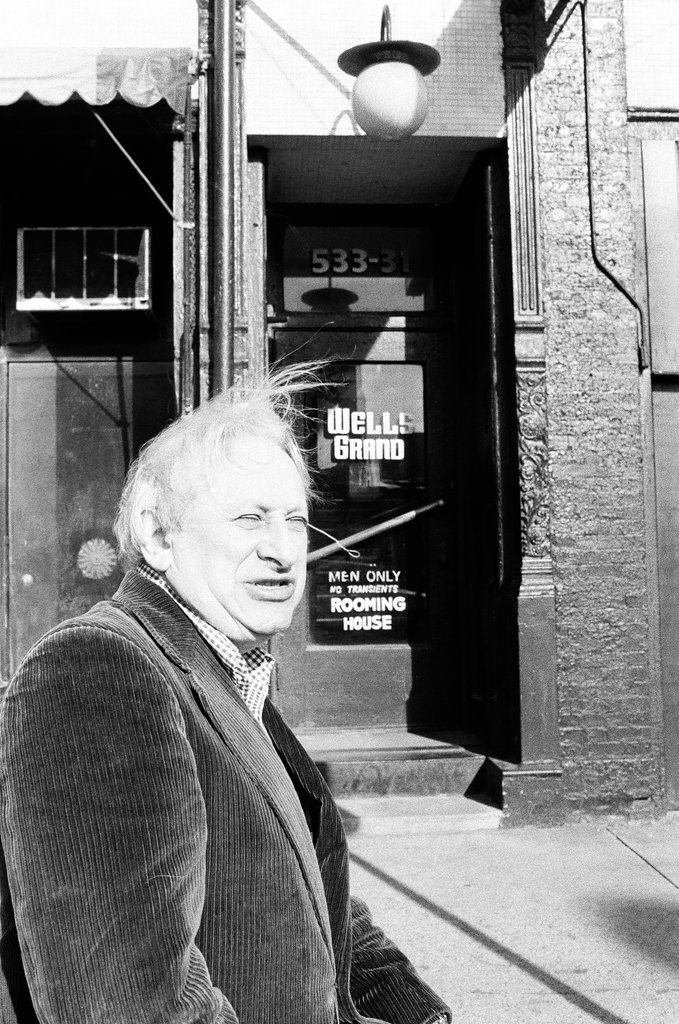 Studs Terkel stands in front of the Wells-Grand Hotel - Ray Burley for Chicago Sun-Times
