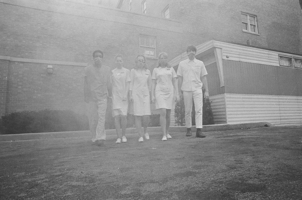 Students in the medical field wear protective masks outside due to low-lying smog - Chicago Sun-Times