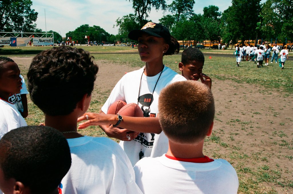 Children and young adults participate in a free football camp at Marquette Park - Chicago Sun-Times