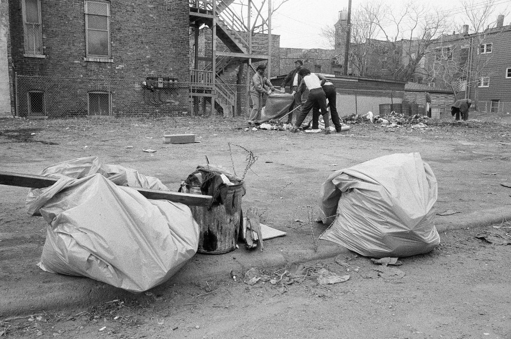 Temporary city workers take part in a community clean up project on the West Side - Chicago Sun-Times
