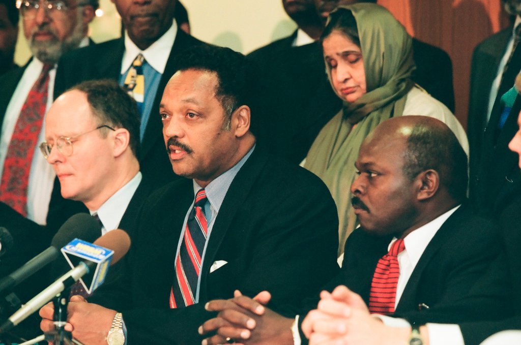 Jesse Jackson speaks with other community leaders at a detention center - Chicago Sun-Times