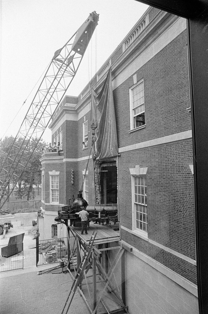The 1848 Pioneer locomotive gets placed into the Chicago Historical Society building - Chicago Sun-Times