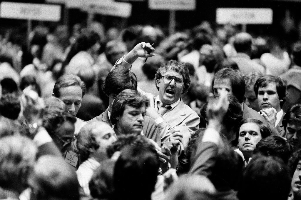 Traders buy and sell shares on the floor of the Chicago Mercantile Exchange - Chicago Sun-Times