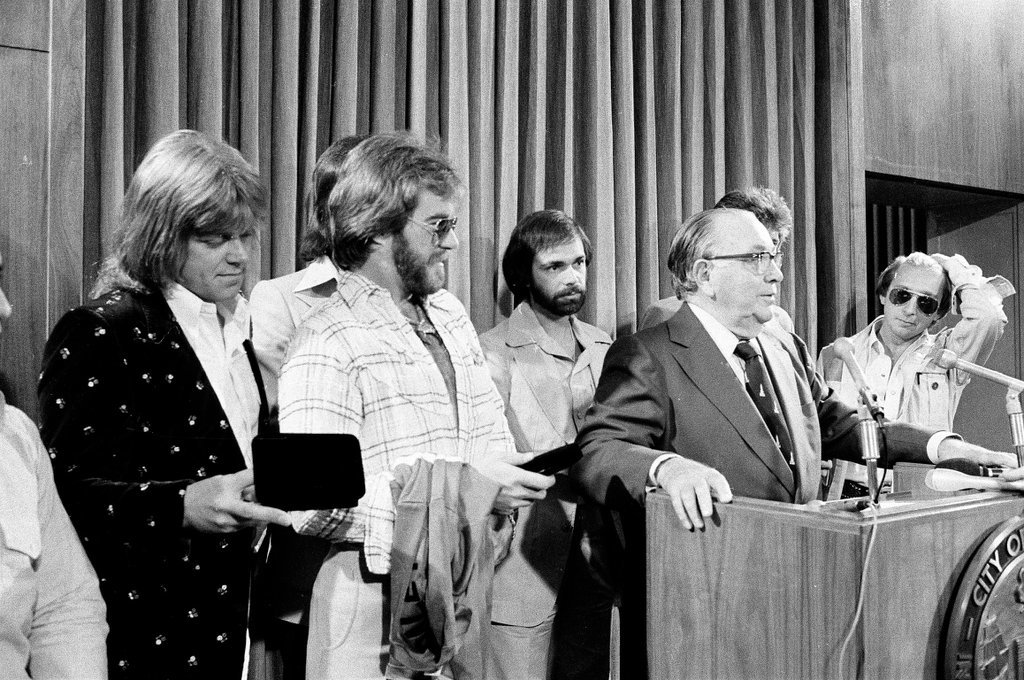 Local rock group Chicago presents Mayor Richard J. Daley with a branded t-shirt at a press conference - Carmen Reporto for Chicago Sun-Times