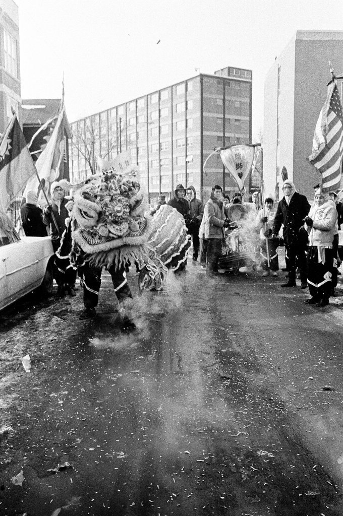 Crowds line South Wentworth Avenue as dancing dragons parade through Chinatown - Chicago Sun-Times