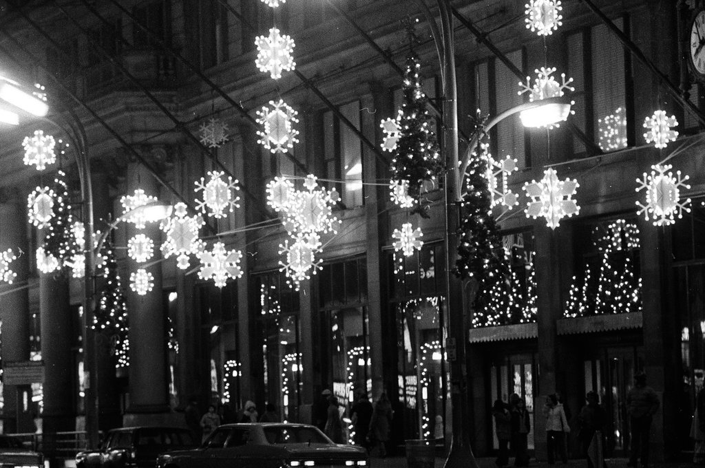 Christmas scenes and decorations lining windows on State Street - Chicago Sun-Times