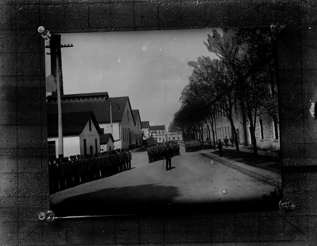 Imprisoned people lined up in yard - Wetmore, S. W.