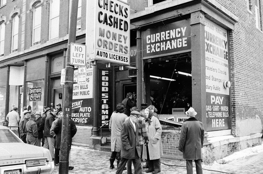 Police investigate a currency exchange at 1207 West Grand Avenue after a fire bomb detonated - Chicago Sun-Times