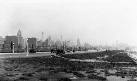 View of cars on Outer Drive (Lake Shore Drive) showing skyline - Unknown
