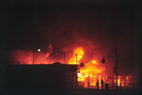 View of a building on fire during the 1967 Detroit uprising - Haun, Declan, 1937-1994