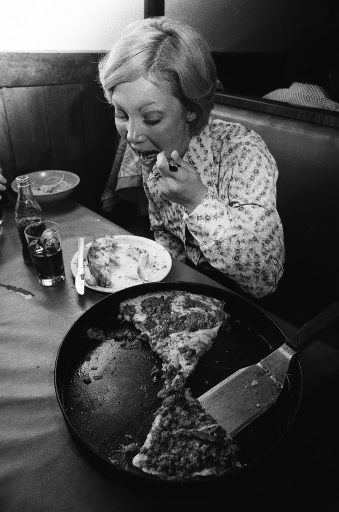 Woman eating deep-dish pizza at Pizzeria Due - Chicago Sun-Times