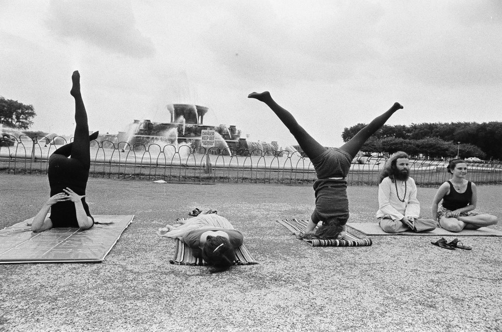 Members of the Temple of Kriya Yoga practice yoga at the Buckingham Fountain - Chicago Sun-Times
