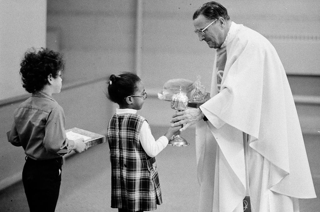 Parishioners at Immaculate Conception Church celebrate a Thanksgiving mass - Chicago Sun-Times