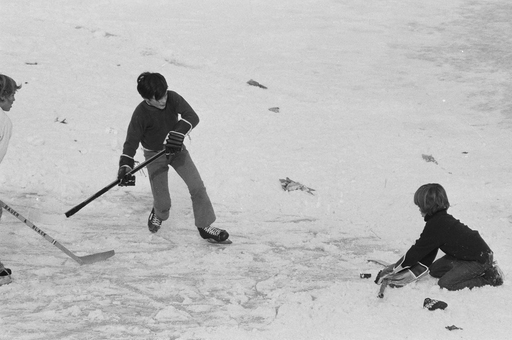 Teens play hockey on a frozen-over lagoon - Chicago Sun-Times