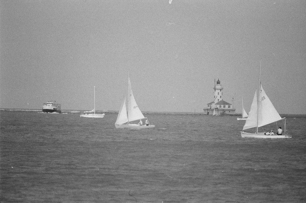 People relax by the lake by the Adler Planetarium - Chicago Sun-Times